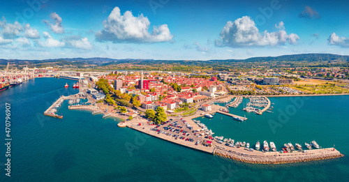 Exciting summer view from flying drone of Koper port. Aerial outdoor scene of Adriatic coastline, Slovenia, Europe. Splendid Mediterranean seascape. Traveling concept background.