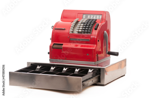 Vintage red cash register on white background