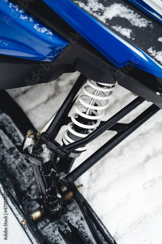 Close-up of a sports snowmobile suspension, white reinforcement