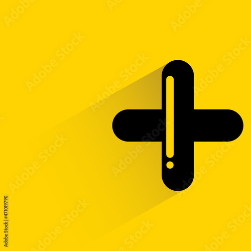 plus and add symbol with shadow on yellow background