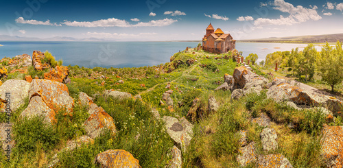 Panoramic scenic view of the famous ancient monastery of Hayravank in Armenia with the legendary Lake Sevan in the background. Travel attractions concept