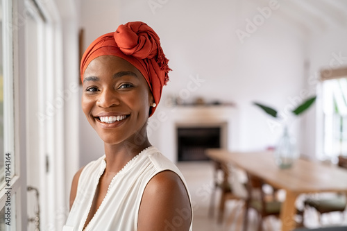 Smiling black mid adult woman wearing traditional turban