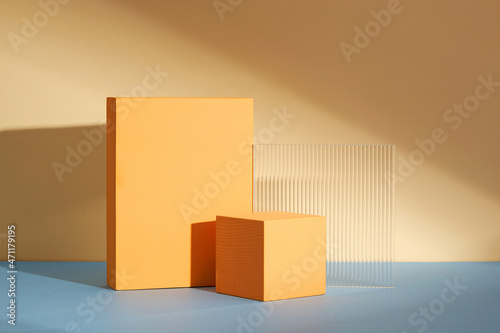Front view of orange podium in a beige background for advertising , abstract content