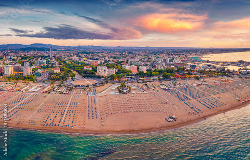 Impressive summer view from flying drone of Libera Rimini public beach. Wonderful summer scene of Italy, Europe. Superb evening view of Adriatic coast. Traveling concept background.