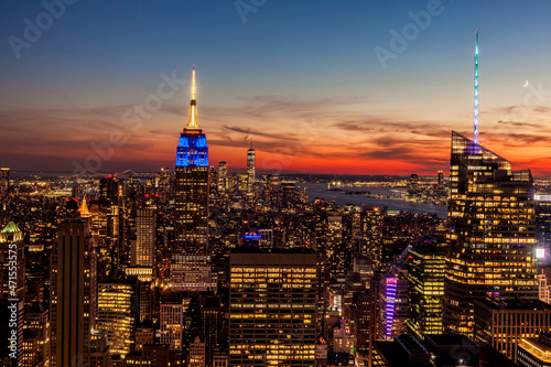 View of Manhattan looking out over the Empire State Building, One World Trade Center and the Statue of Liberty