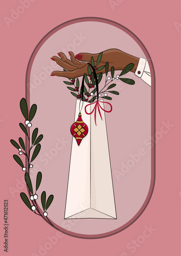 Kobieca ręka trzymająca torebkę podarunkową. Dziewczyna oferująca prezent. Bożonarodzeniowa ilustracja z pakunkiem prezentowym, bombką, jemiołą i innymi świątecznymi dekoracjami. Wektorowa ilustracja.
