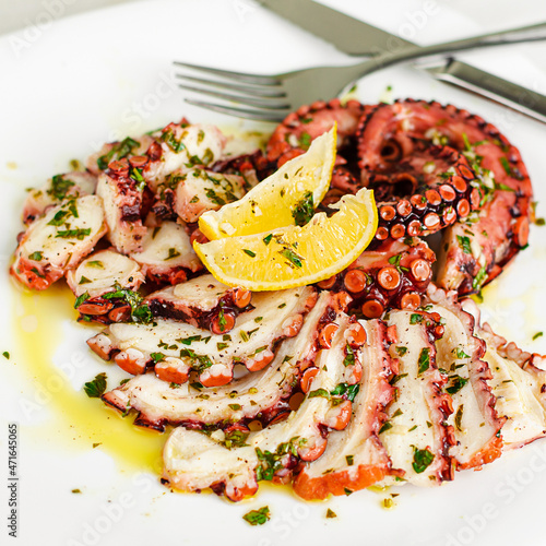 Octopus carpaccio on white background. Mediterranean food, Organic Healthy eating.