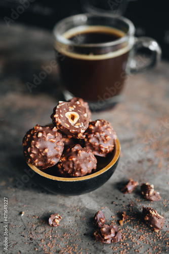 Handmade chocolate ferrero rocher in plate at dark background