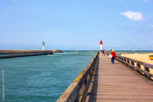 seascape with pier and two lighthouses 