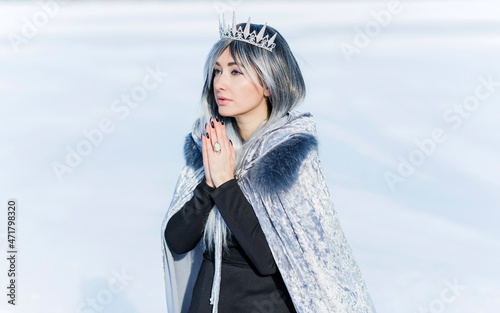 Portrait of fashionable Snow queen with a Chrystal crown, fancy jewelry and accessorize