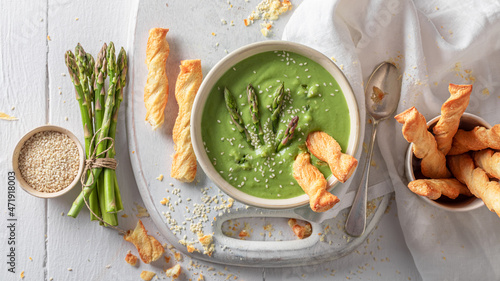 Vegan creamy asparagus soup as perfect starter in restaurant.