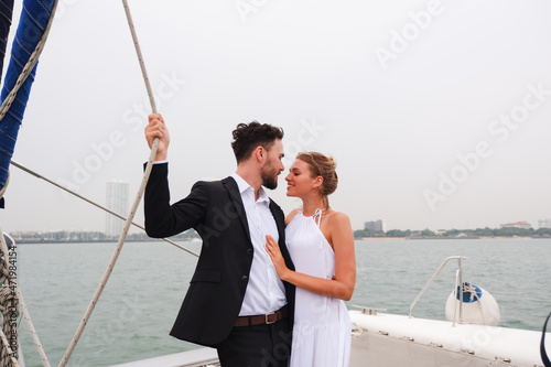 Portrait caucasian couple in love romance on luxury white yacht