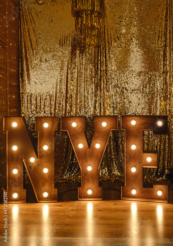 Loft idea for Christmas. Bulb lights on wooden stand letters NYE.