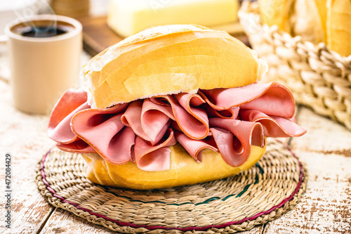 Brazilian bread sandwich with mortadella. Traditional pork snack served in bakeries in Brazil, french bread with bologna