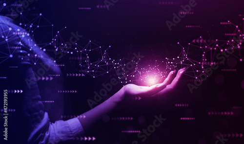 Metaverse Technology concepts. Woman hand holding global network connection. Internet communication, Wireless connection technology. Futuristic technology with polygonal shapes. 