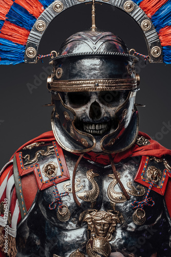 Angry zombie centurion dressed in steel armor and plumed helmet