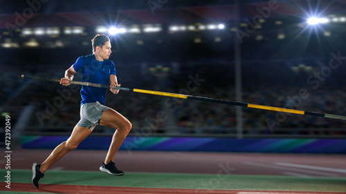 Pole Vault Jumping: Professional Male Athlete on World Championship Running with Pole to Jump over Bar. Shot of Competition on Big Stadium with Sports Achievement Experience