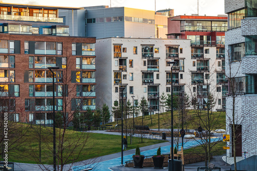 European residential complex of apartment buildings. Outdoor facilities. Eco-friendly living in city. Modern block of flats. Scandinavian architecture Courtyard Lifestyle Helsinki Finland Cycling path