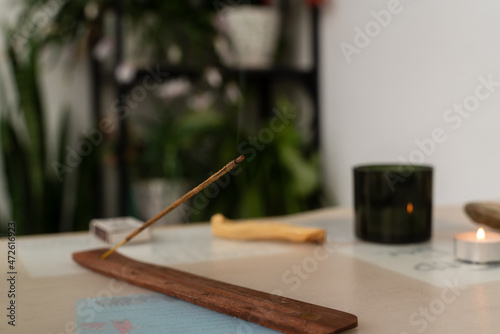 Burning aromatic incense stick for meditation and relaxing. Aromatherapy smoke. Selective focus