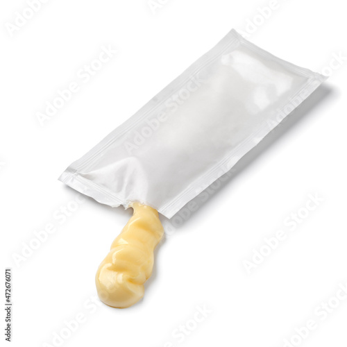 Mayonnaise from a disposable sachet isolated on white background