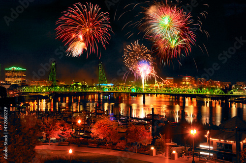USA, Oregon, Portland. Fireworks over river and bridge.