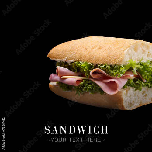 Italian Ciabatta bread sandwich with ham slices, cheese and fresh lettuce served without plate. Isolated on black background. Copy space image. Text place web banner 