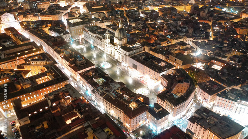 Aerial drone night shot of iconic masterpiece elliptic square - Piazza Navona, Rome historic centre, Italy