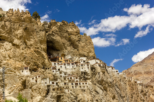 The ancient Tibetan Buddhist Phuktal monastery of on a steep rocky hillside in the Zanskar region in Ladakh in the Indian himalaya.