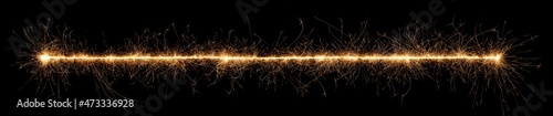 golden bright sparkler wide panorama tracer fuse line isolated dark black background. anniversary, pyrotechnics, wedding and happy birthday celebration party concept