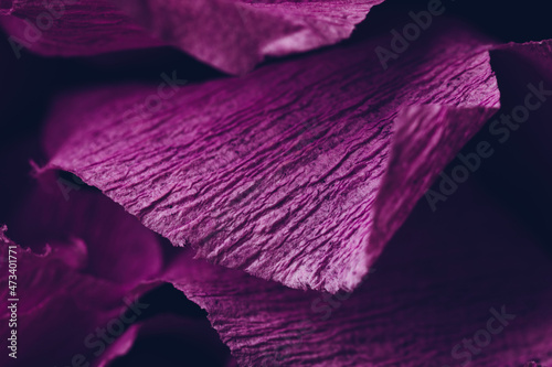 Fragment of a purple flower made of crepe paper. Macro photography