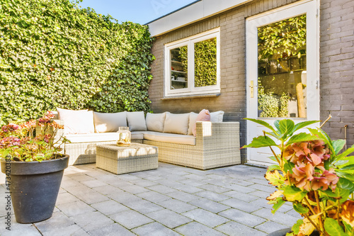 The courtyard of the house with a soft beige sofa