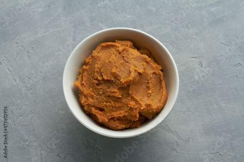 miso paste shiro miso in a bowl on grey background