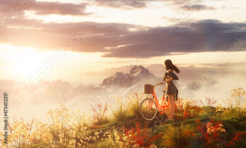 White caucasian adult woman with a bicycle in the meadows on top of a mountain. 3d rendering art. Sunset Sky. Aerial landscape background image from British Columbia, Canada.