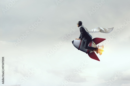 Businessman on a rocket . Mixed media