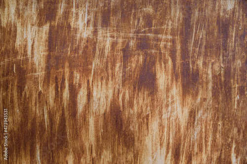 Rust metal surface. Texture of a rusty metal surface with remains of white paint applied with vertical chaotic brush strokes, high resolution.