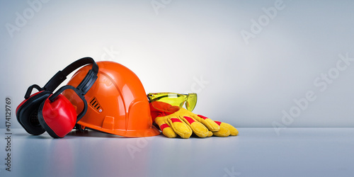 Work safety protection equipment on grey background with copy space. Horizontal banner.