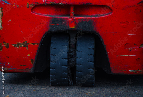 Twin coupled rear wheels of Electric three-wheel counterbalance forklift truck in Red color.