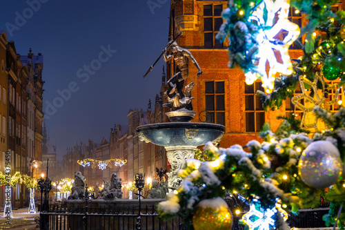 Beautiful Christmas tree and Neptune's Fountain in Gdansk at winter. Poland