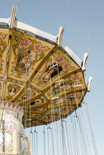 Chain carousel in amusement parks carnivals or funfair on background of sky. Volgograd, Russia.