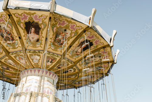 Chain carousel in amusement parks carnivals or funfair on background of sky. Volgograd, Russia.