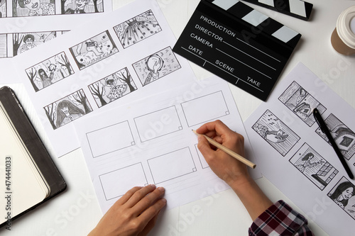 The artist draws a storyboard for the film. The director creates the storytelling by sketching footage of the script on paper.