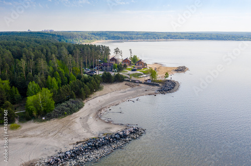Aerial view of the shore with taiga Siberian forest and cottages on the Ob Sea in Novosibirsk, Russia