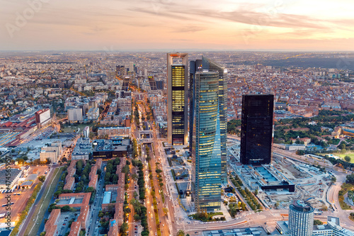 Views of the four towers during sunset in the city of Madrid during a sunny and cloudless day, Spain.