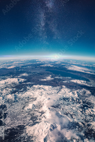 View of stars and milkyway above Earth from space. Beautiful space view of the Earth with cloud formation