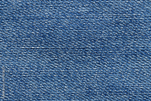 Macro photo of blue jeans material. Fabric background.