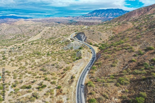 Aerial view of the landscape of the Sonoran desert in the horizer, mountains and lines of the highway lanes in the municipality of Imuris, Mexico. drought, lack of water in the region