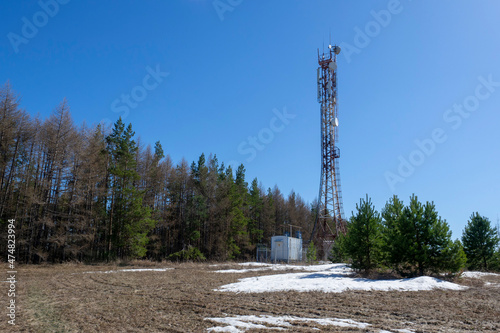 Metal tower antenna digital television transmitter. Mobile cellular tower.