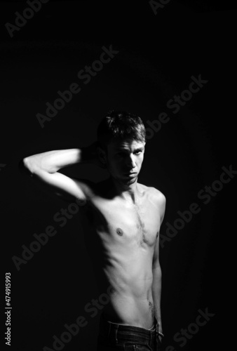 Skinny young man posing fashion, anorexic look, slim body.