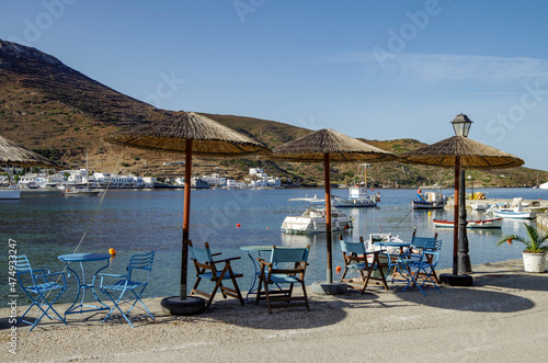 Picturesque landscape scenic view of Greek Island coastal town city of Amorgos Island in Greece with historic ancient old city skyline house building facades, rocks beach overlooking bay