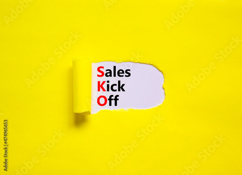 SKO sails kick off symbol. Concept words SKO sails kick off on white paper. Beautiful yellow background, copy space. Business and SKO sails kick off concept.